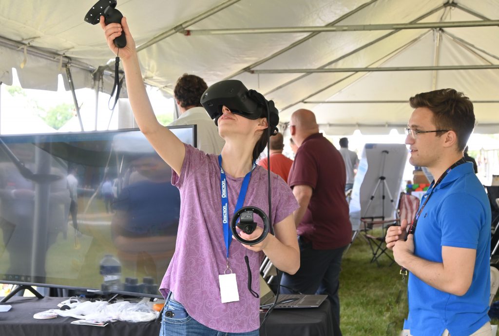 Participant of Goddard on the Green experiencing the VR/AR demo.