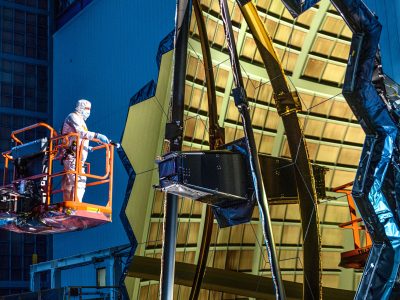 Engineer conducts an inspection on NASA’s James Webb Space Telescope.