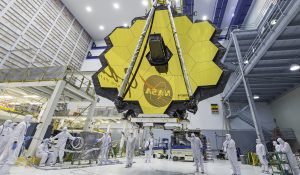 Technicians lift the mirror of the James Webb Space Telescope using a crane at the Goddard Space Flight Center in Greenbelt, Md.