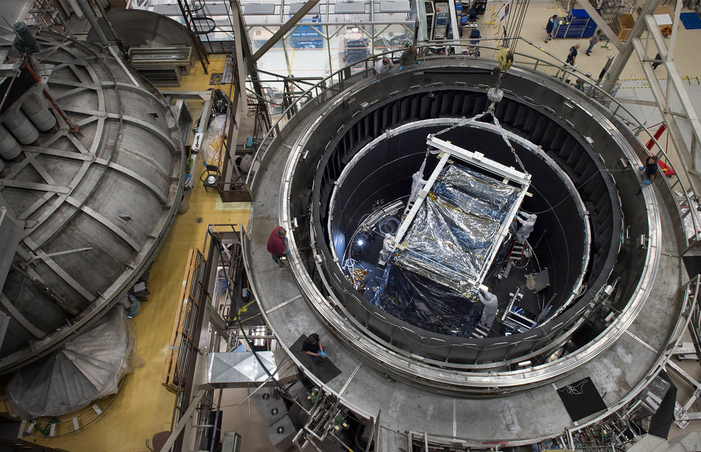 A crane lifts the flight instruments of the James Webb Space Telescope from the Goddard thermal vacuum chamber where it spent weeks in a space-like environment being cryogenically tested.