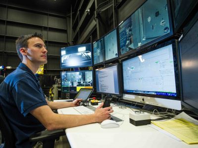 From a control center at Goddard, a lead roboticist commands a robot from more than 800 miles away. Credit NASA/Chris Gunn