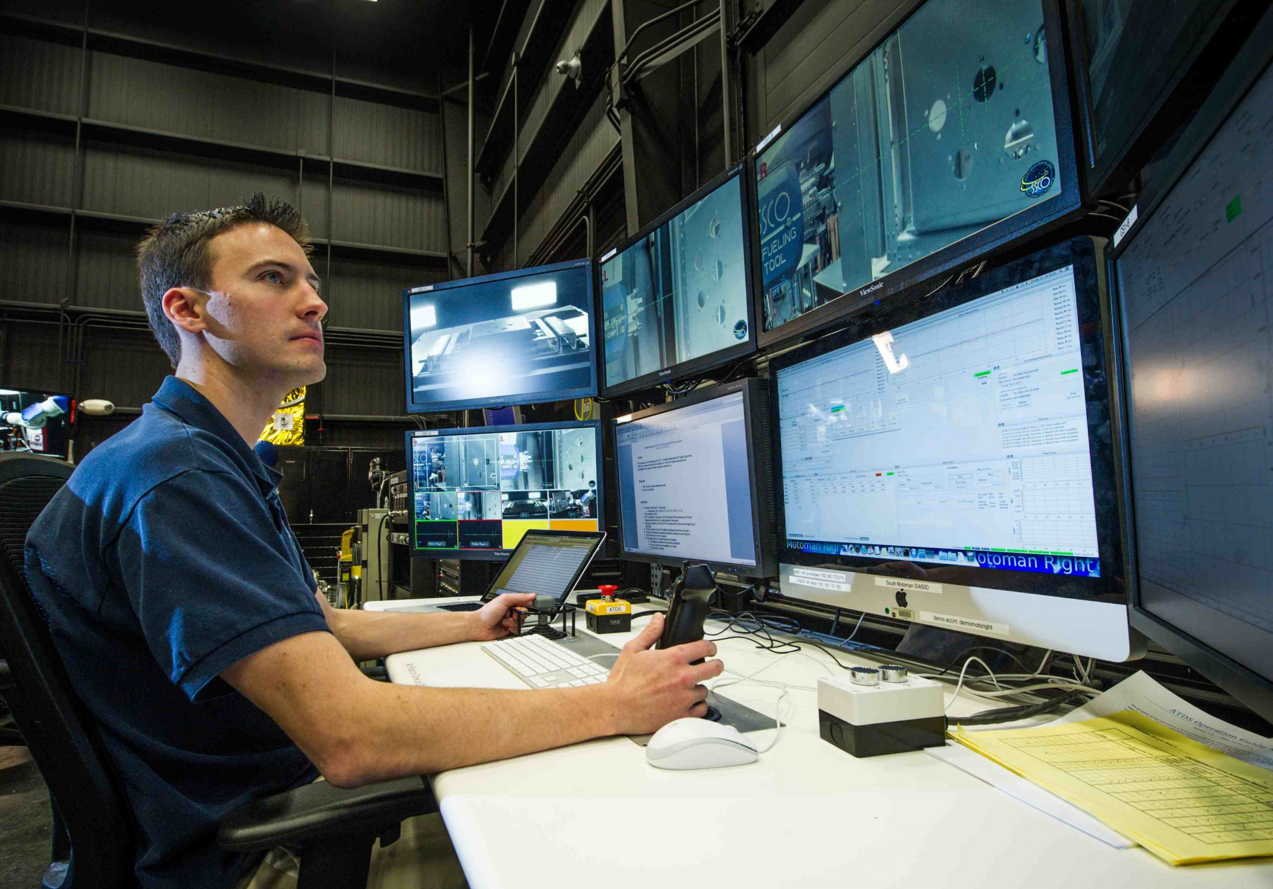 From his control center at Goddard, lead roboticist Alex Janas commands the RROxiTT robot from more than 800 miles away at Kennedy. Credit NASA/Chris Gunn