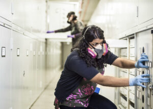 NASA Thermal Coatings Engineer Nithin Abraham removes samples treated with a patent-pending adsorber from specimen-storage cabinets at the Smithsonian’s Museum Support Center in Suitland, Maryland