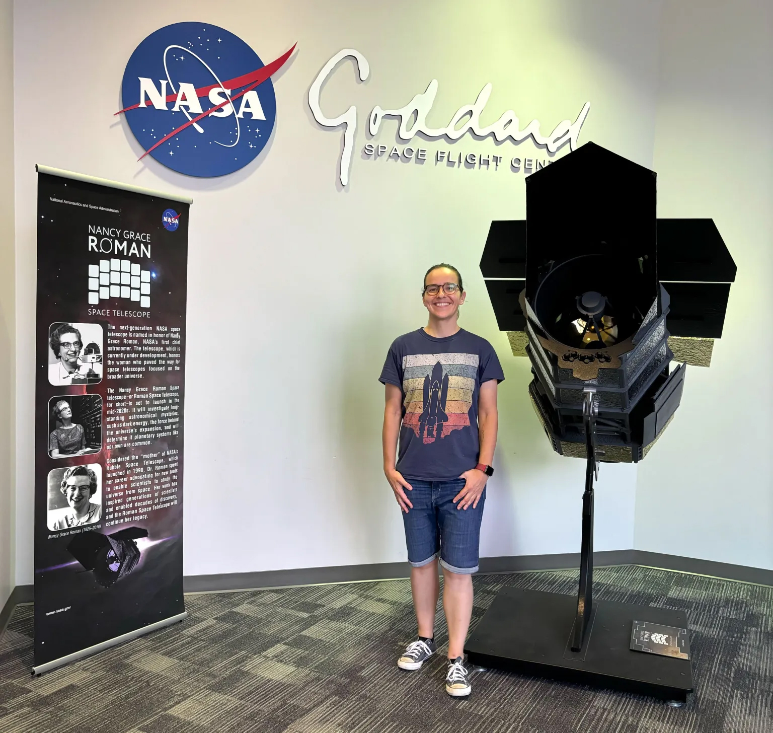 Dr. Ariadna Farrés-Basiana is an astrodynamics and solar radiation pressure specialist at NASA’s Goddard Space Flight Center in Greenbelt, Md, standing next to a model of the Nancy Roman Space Telescope. Photo courtesy of Ariadna Farrés-Basiana