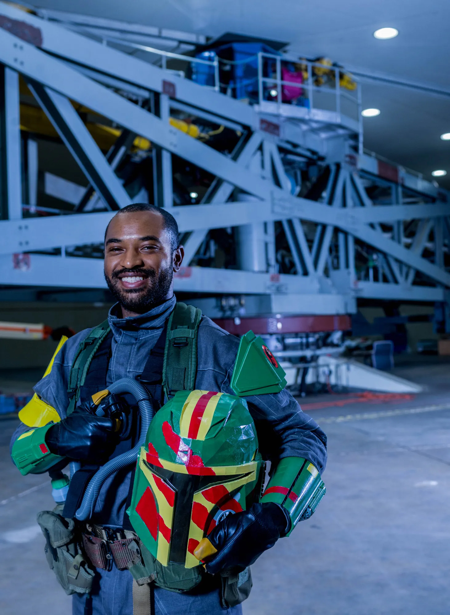 NASA mechanical engineer Glenn Bazemore’s creativity extends beyond work to pop culture pursuits as well. “I’m really a nerdy person. I collect Legos and action figures. I go to comic cons,” he said. In this photo, he wears a costume inspired by the television show “The Mandalorian” and the movie “Jurassic Park.” Photo Credit: NASA / Chris Gunn