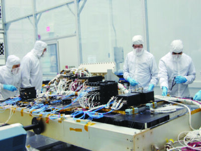 Five engineers working on the Integration of the LRO Avionics Module