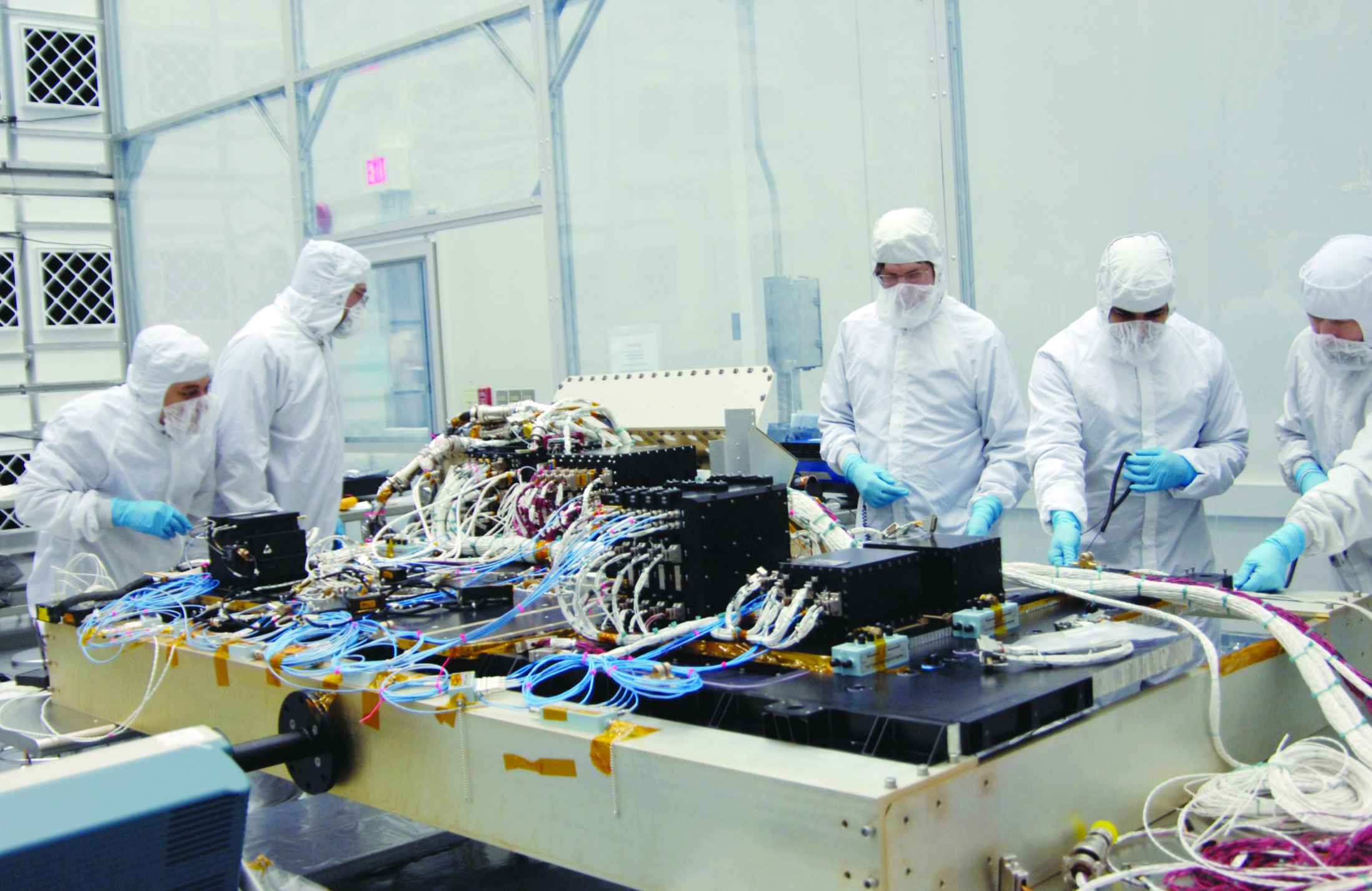 Five engineers working on the Integration of the LRO Avionics Module