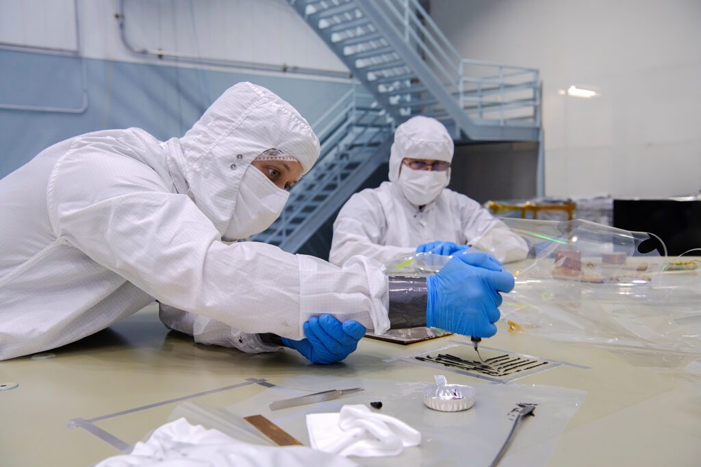 Engineer, Colton Cohill bonding thermal hardware for the Roman Space Telescope (RST)