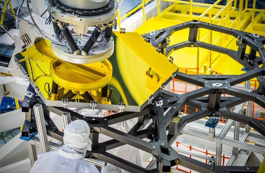 James Webb Space Telescope (JWST) Prime Mirror Segment Assembly (PMSA) Operations in the Spacecraft Systems Development and Integration Facility (SSDIF).