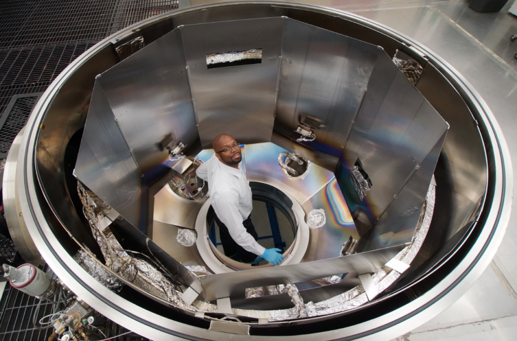 Engineer Felix Threat and Goddard’s 2-meter diameter, thin films coating chamber