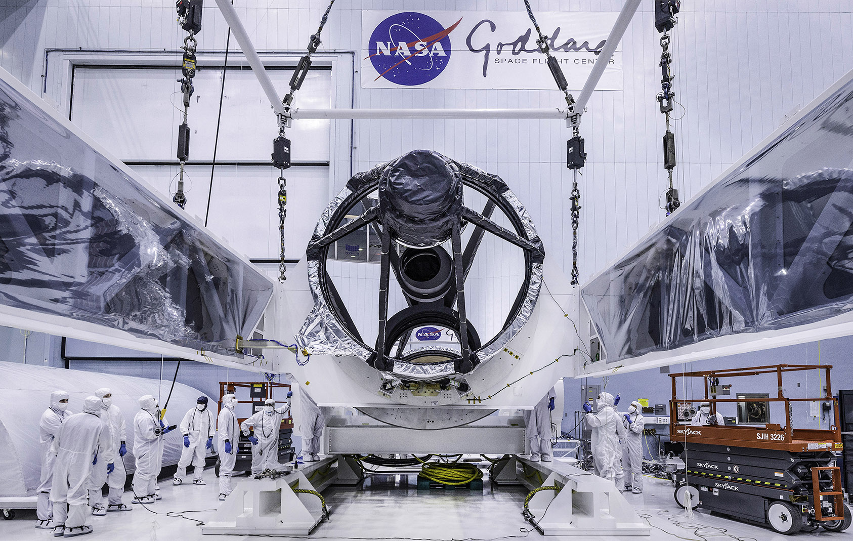 Technicians lift the mirror of the James Webb Space Telescope using a crane at the Goddard Space Flight Center in Greenbelt, Md.