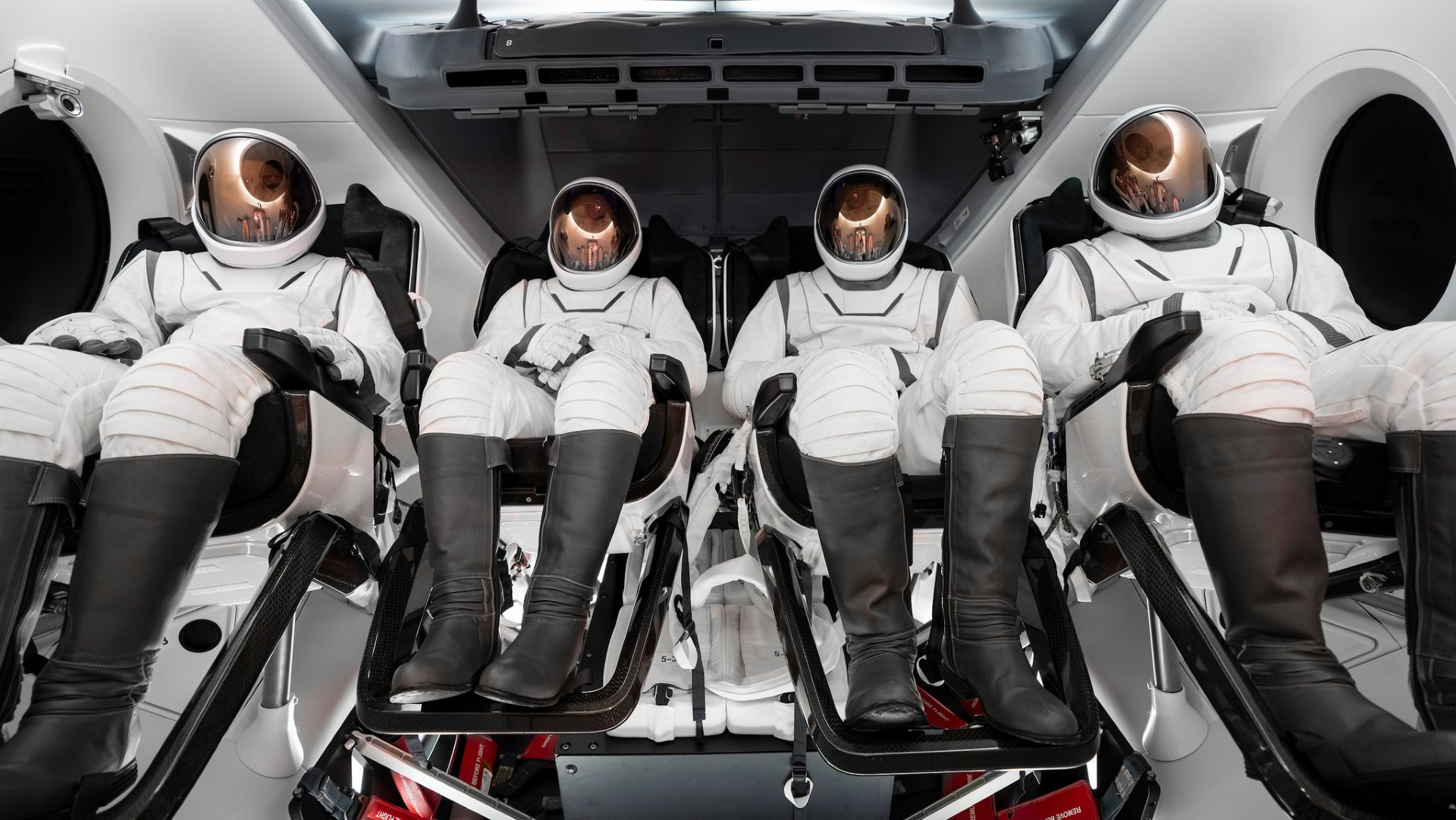 The four-person crew of the Polaris Dawn mission pictured wearing their SpaceX extravehicular activity suits. The crew consists of Pilot Scott Poteet, Mission Specialists Sarah Gillis and Anna Menon, and Commander Jared Isaacman.