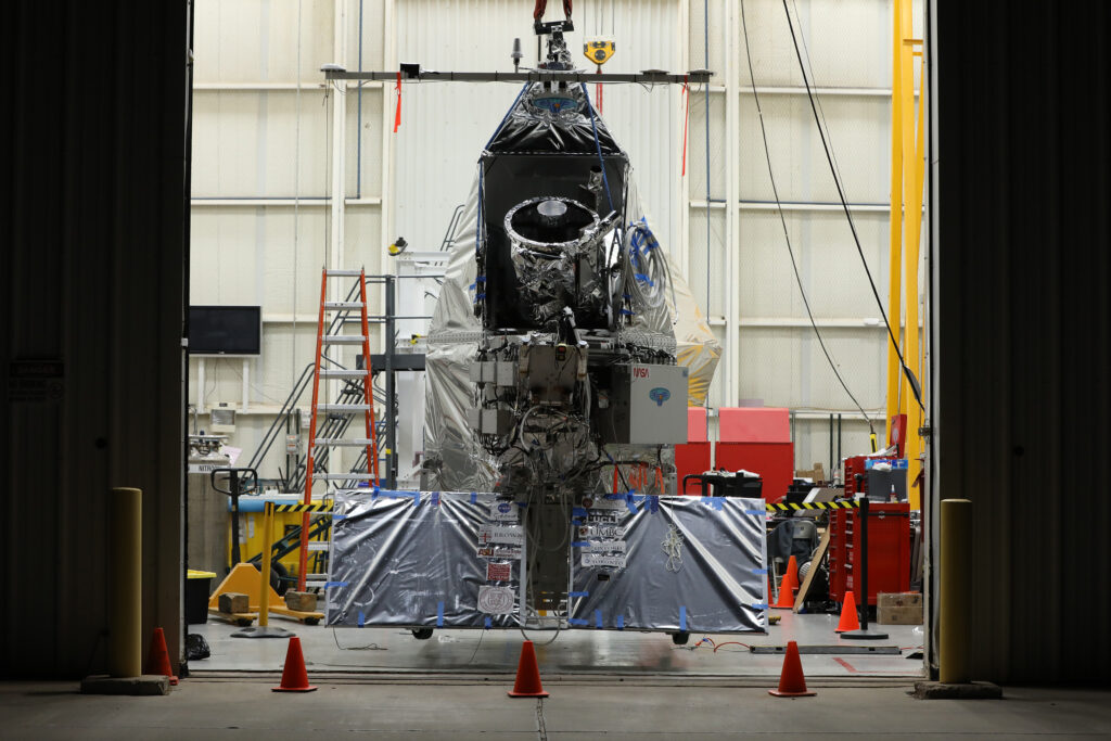 EXCITE (EXoplanet Climate Infrared TElescope) hangs from a ceiling at the Columbia Scientific Balloon Facility