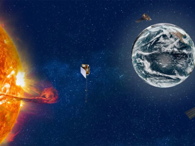 Illustration of the Sun and Earth, with multiple spacecrafts in space.