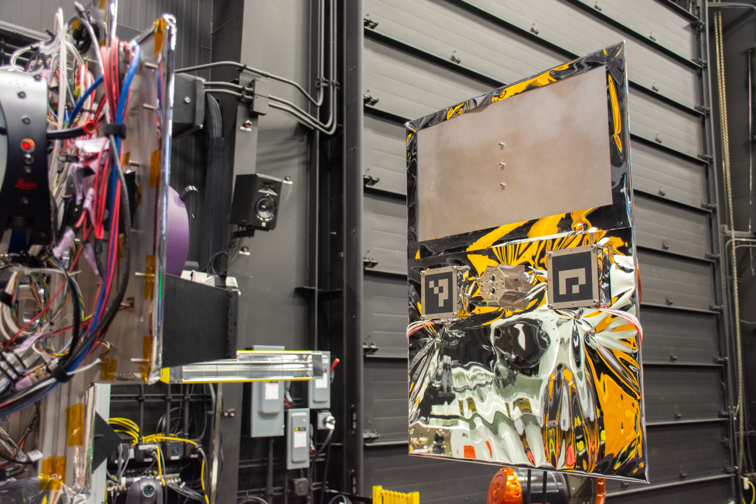 Robotic motion platforms simulating rendezvous and proximity operations (RPO) in the Servicing Technology Center (STC).