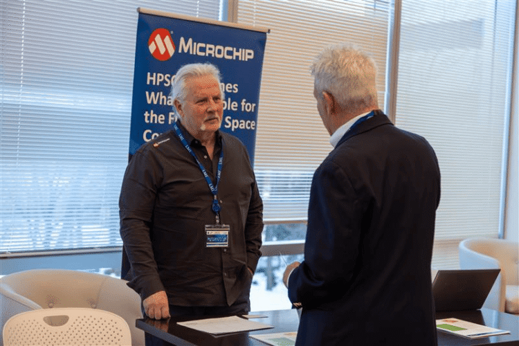 Attendees network at Microchip's booth during the 2026 NASA cFS Symposium. Microchip presented its radiation-hardened High-Performance Spaceflight Computing (HPSC) processors, featuring 64-bit octal-core architecture, TSN Ethernet switching, and edge AI processing capabilities designed for demanding space missions. Microchip vendor booth at the 2026 cFS Symposium.